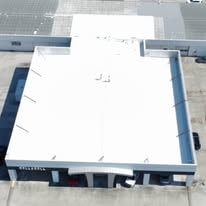 Bell & Bell GMC dealership roof after white coating