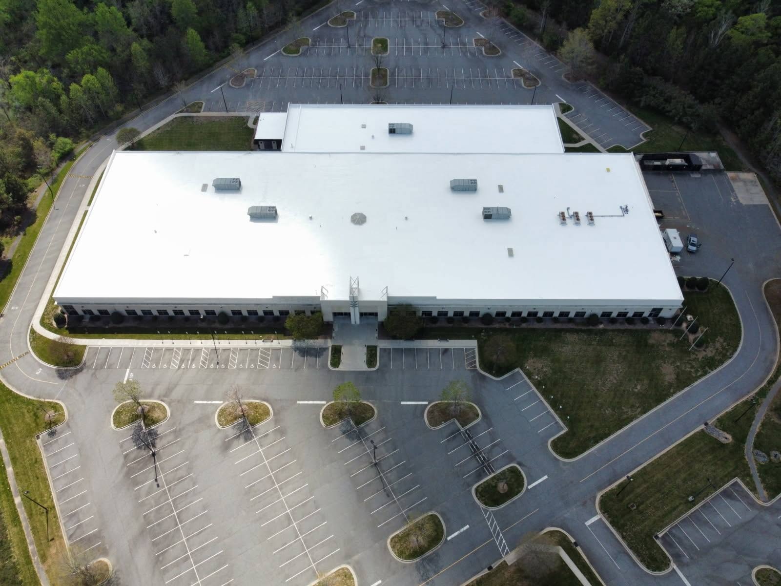 Fort Mill commercial property completed white roof coating — aerial view
