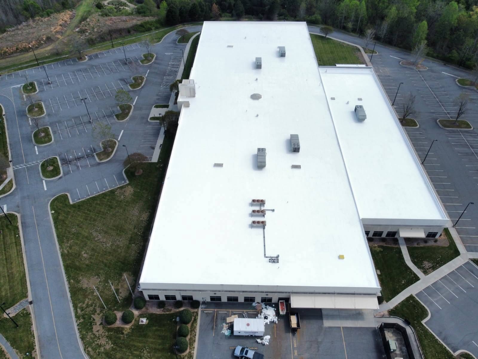 Fort Mill commercial property completed white roof coating — drone overview