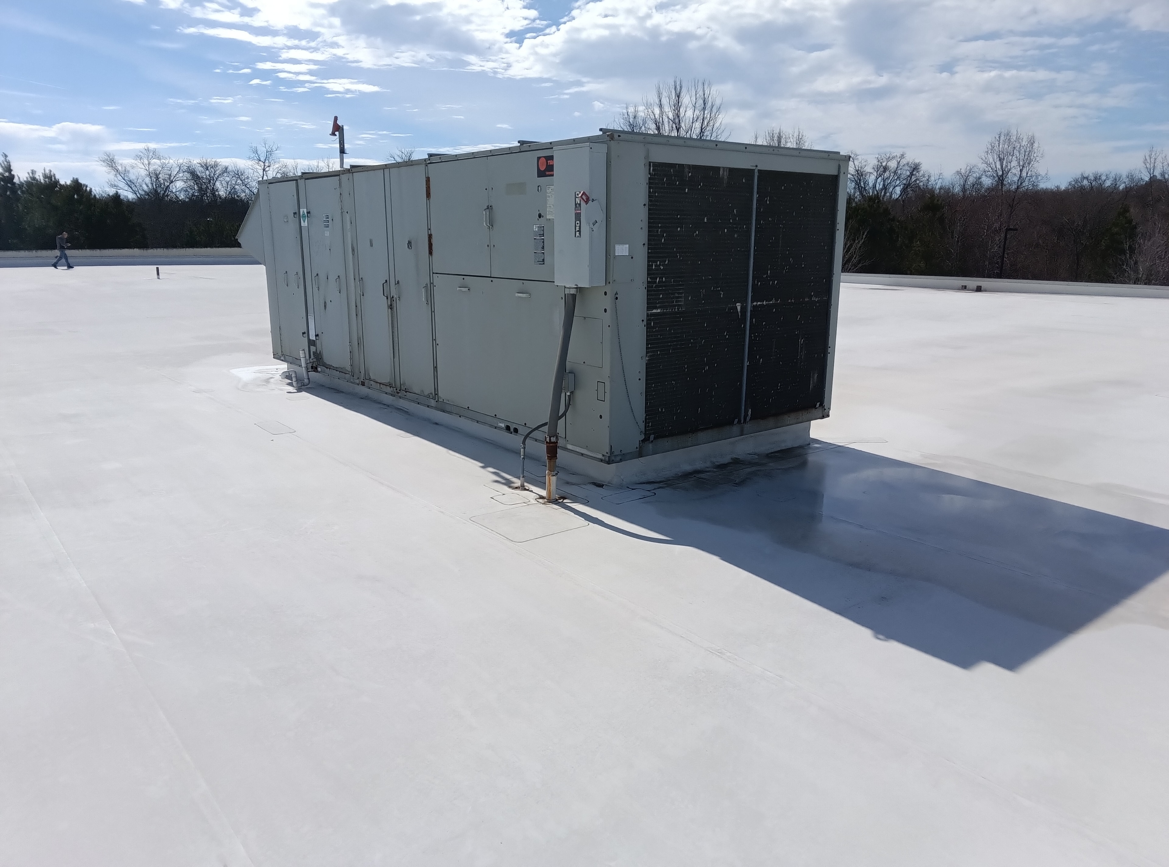Fort Mill commercial roof before coating — skylight and hatch area