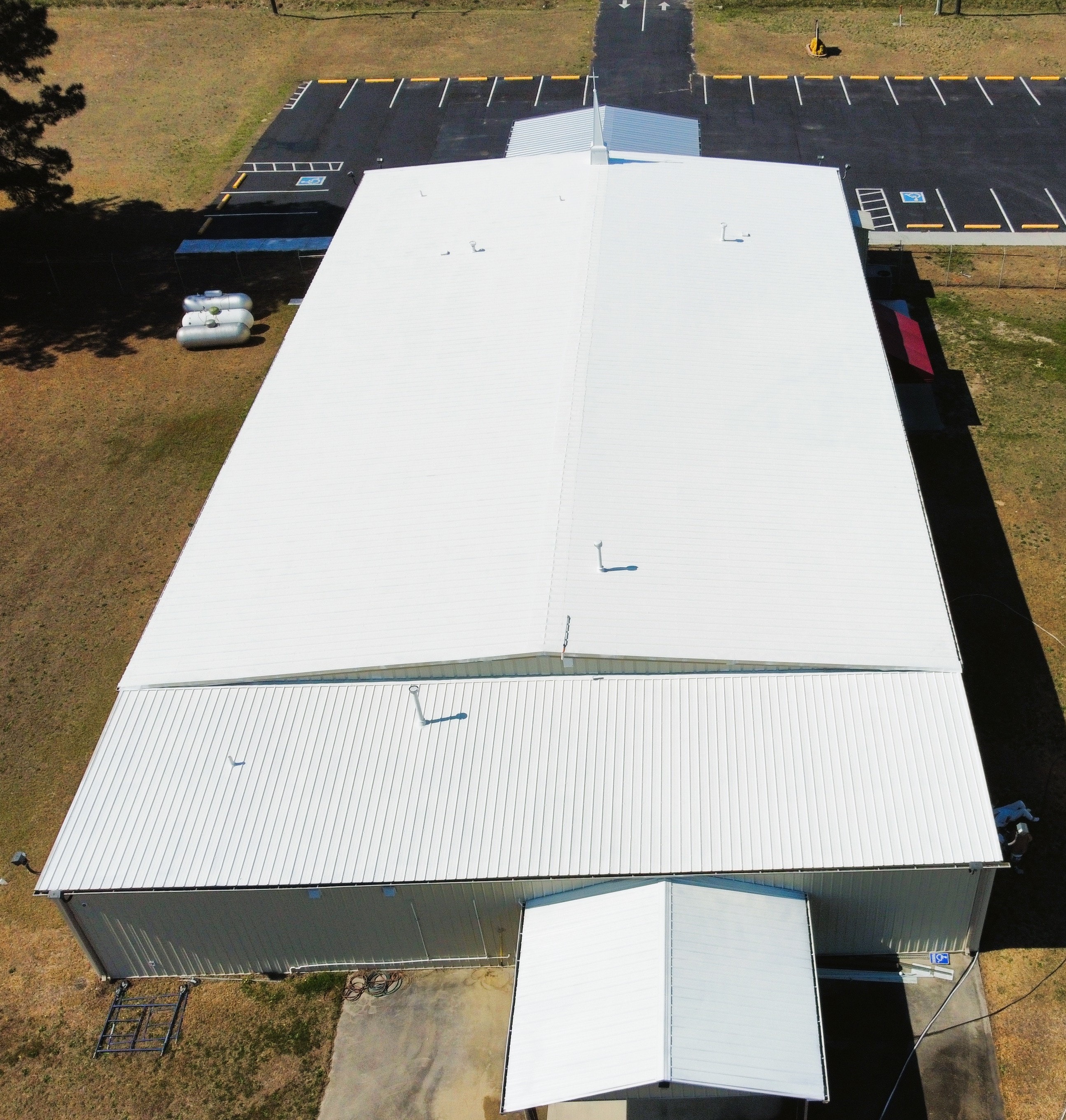 Lumber Bible Church completed white roof coating — aerial overview