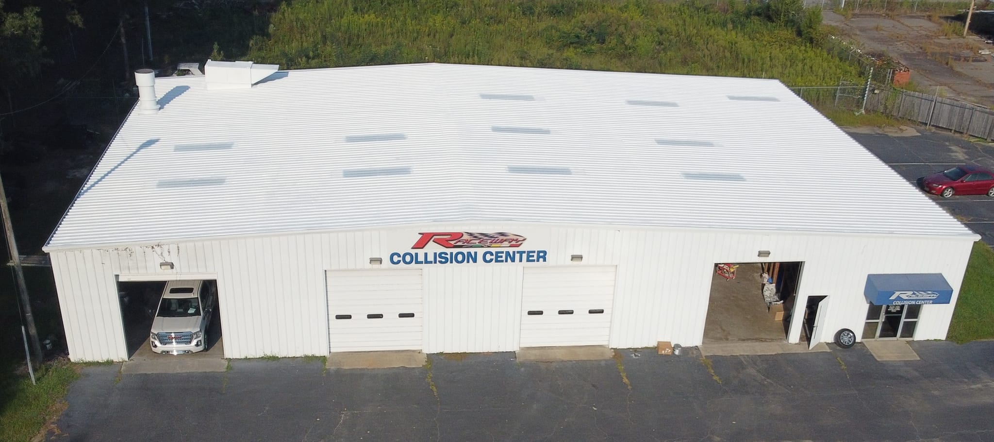 Raceway Chevrolet dealership completed white roof coating — aerial view