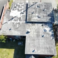 Ridgeville Police Station & Community Center roof before coating — deteriorated dark surface